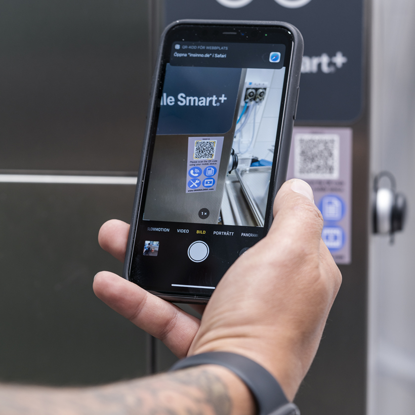 Person scanning the SIMpel QR code